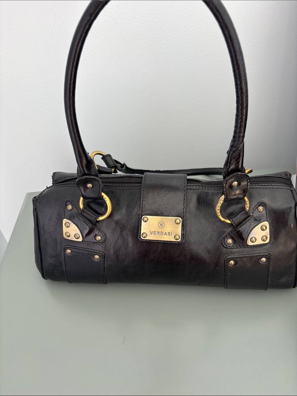 Verdasi Black Leather Barrel Shoulder Bag with Gold Accents